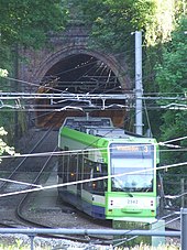 A photo of the accident site in 2010, showing a tram exiting the tunnel and entering the curve