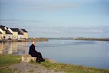 Ballyknow Quay, Claddagh, Galway, with The Long Walk in the background