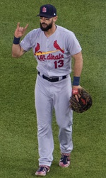 Stan Musial wearing the Cardinals' 1950s road uniform with the original navy cap and red bill.