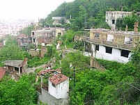 Left: Destroyed Serbian Orthodox Holy Trinity Church in Petrić villageRight: Ruins of a Serb part of Prizren destroyed during 2004 unrest in Kosovo.