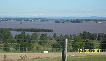 Left image shows Hinton from Brandy Hill, shortly after the June 2007 Hunter Region and Central Coast storms. The right image was taken after the floodwaters had subsided.