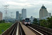 A train of the Kelana Jaya line passing through Asia Jaya 5