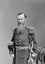 A greyscale image of a man in a wool military uniform