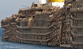 Starboard side of the righted Costa Concordia, showing crush damage from the rock spurs upon which she had rested