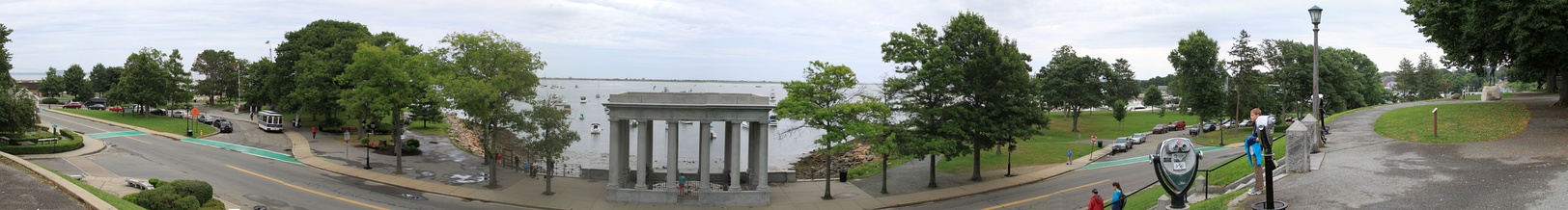  The present (1920) superstructure designed by McKim, Mead, and White for the Tercentenary of Plymouth Rock with the replica Mayflower II (left, behind trees) and Cole's Hill (right) with the Statue of Massasoit