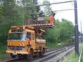 Road-rail vehicle with elevated platform for installing catenary