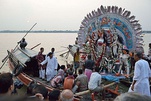 From top left to bottom right (a) Structure of a Durga sculpture-idol being made at Kumortuli; (b) Lady carrying offerings for the puja; (c) Sandhi puja on the day of Ashtami; (d) Immersion of the sculpture-idol on Vijaya Dashami.