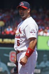 Stan Musial wearing the Cardinals' 1950s road uniform with the original navy cap and red bill.