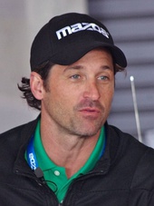 Patrick Dempsey wearing a cap looking away from the camera