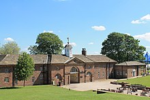 Photograph of the mid-18th century stable block at Temple Newsam showing the pediment