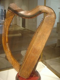 A Photo of a wooden harp with two curved sides.