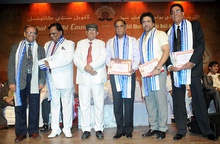 Govinda with five other men onstage