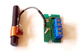 LC circuit (left) consisting of ferrite coil and capacitor used as a tuned circuit in the receiver for a radio clock