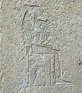 wornout relief of a seated woman