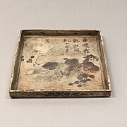 Square dish with grapes that was exhibited at the 1873 Vienna World's Fair. It was later salvaged from the sunken ship Le Nil that was transporting it back to Japan.[1][2]