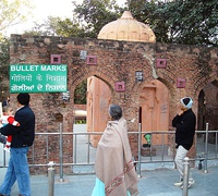 Bullet marks, visible on preserved walls, at present-day Jallianwala Bagh