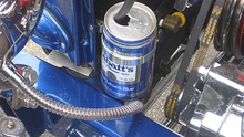 a beer can with a hose going into it