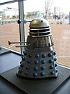 Various Dalek designs from throughout the series, including variants such as the Special Weapons Dalek and the Dalek Emperor.