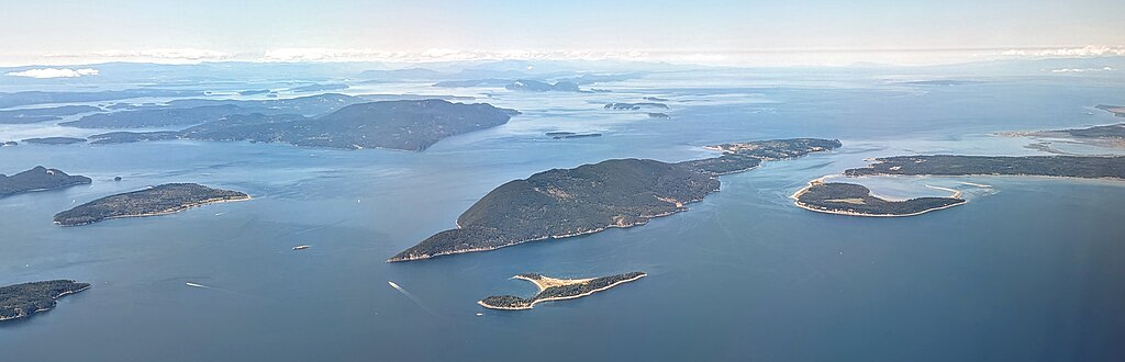  Aerial view of Lummi Island and vicinity from the east, with Eliza Island in foreground, Portage Island to the right near the Lummi Peninsula, Sinclair Island to the left, and Orcas Island behind