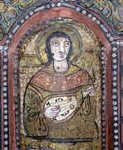 (Left-two images) Oud-family instruments painted in the Cappella Palatina in Sicily, 12th century. Roger II of Sicily employed Muslim musicians in his court, and paintings show them playing a mixture of lute-like instruments, strung with 3, 4 and five courses of strings. (Right) 13th century A.D. image of an Oud, from the 12th century work Bayâd und Riyâd, a larger instrument than those in images at the Cappella Palatina