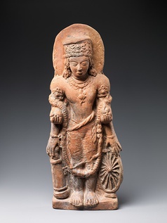 A terracotta statue of Vishnu Caturanana ("Four-Armed"), using the attributes of Vāsudeva-Krishna, with the addition of an aureole around the head (5th century CE). Uttar Pradesh.[20]