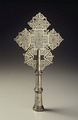 Brass, latticework processional cross (socketed for staff) latticework reminiscent of Celtic knot-work, Amhara Region, mid 20th century.