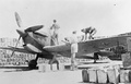 Refuelling and rearming a Spitfire Mark VC(T), in a revetment constructed from empty fuel tins filled with sand at RAF Ta Kali, Malta in 1942