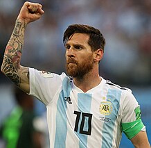 Cristiano Ronaldo (left) and Lionel Messi (right) celebrate after scoring.