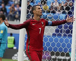 Cristiano Ronaldo (left) and Lionel Messi (right) celebrate after scoring.