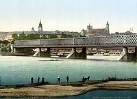 Kierbedź Bridge over the Vistula in Warsaw (c. 1900). This framework bridge was constructed by Stanisław Kierbedź in 1850–1864. It was destroyed by the Germans in 1944.[42]