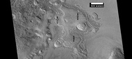 Brain terrain being formed from a thicker layer, as seen by HiRISE under HiWish program. Arrows show the thicker unit breaking up into small cells.