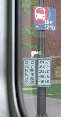 An old Metro Transit bus stop sign in downtown Saint Paul, unusually detailed for its time, showing all the routes that stop there. Newer, more detailed bus stop signs began to be introduced in 2015.[40]