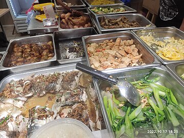 Steamed white amur (蒸鯇魚, front) in a Hong Kong restaurant