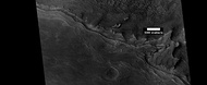 Wide view of mesa breaking up into rocks, as seen by HiRISE under HiWish program. Parts of this image are shown enlarged in the next two images.