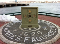 Explorer João Álvares Fagundes commemorative monument surrounded by Portuguese pavement, in Halifax (up) and Azulejos, sign and frame about Portuguese immigration inside a subway station in Toronto (down), both in Canada