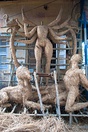 From top left to bottom right (a) Structure of a Durga sculpture-idol being made at Kumortuli; (b) Lady carrying offerings for the puja; (c) Sandhi puja on the day of Ashtami; (d) Immersion of the sculpture-idol on Vijaya Dashami.