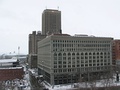 Seneca One Tower (then named One HSBC Center) behind Ellicott Square Building