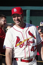 Stan Musial wearing the Cardinals' 1950s road uniform with the original navy cap and red bill.