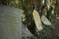 Tottering Victorian headstones in Woolaton, in Nottingham, England