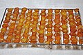 Drying geumgyul-jeonggwa (candied kumquat) on a drying rack