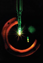 The Novette target chamber (metal sphere with diagnostic devices protruding radially), which was reused from the Shiva project and two newly built laser chains visible in background