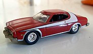 Model cars in 1:64 scale by Hot Wheels and Johnny Lightning, fltr (above): 1969 Chevrolet Corvette, 1977 Pontiac Firebird; (below): 1975 Ford Torino Starsky & Hutch, 1970 Chevrolet Chevelle