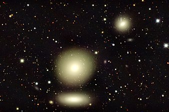 The three large objects in this image captured by the Dark Energy Camera are galaxies in the nearby Fornax cluster, roughly 65 million light-years from Earth.