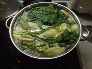 Chicken soup with dark, leafy greens