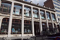 Facade and library of the Centre belge de la Bande dessinée, housed in a building which as cultural heritage is state-owned, and the entrance of the especially built Musée Hergé, both expressive of the state backing the Franco-Belgian comic receives in its native country