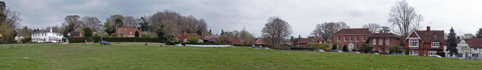  Panoramic of the eastern sector of Chiddingfold village green. The site of the bonfire in the left foreground.