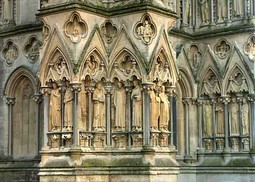 In the lowest range, many statues are lost but this group of saints remains at the back of the north tower.