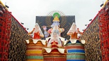 From top left to bottom right (a) A craftsperson sculpting the face of the sculpture-idol; (b) Durga Puja pandal decorations in Kolkata; (c) Interior decorations of a pandal; (d) Street lights installed during the festivities.