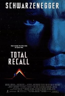 The film poster shows a close up of Arnold Schwarzenegger, with his last name on top and a pyramid shape glowing on top with planets near the bottom. The tagline reads "Get ready for the ride of your life". Below the tagline is the film's name and the bottom contains a list of the film's credits.