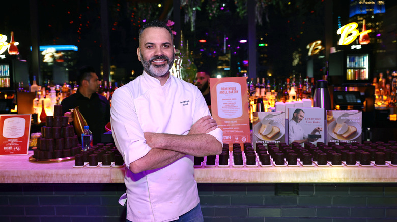 Dominique Ansel smiling with crossed arms at the 2024 NYCWFF